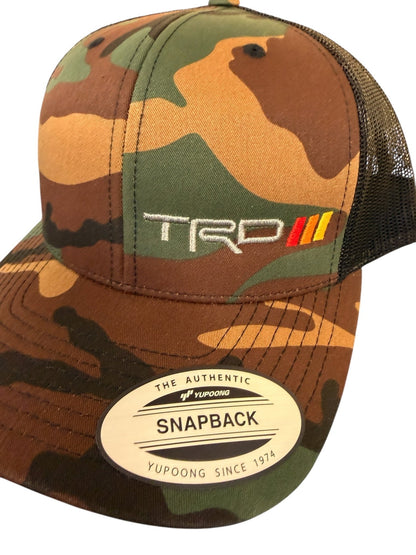 Camouflage cap with TRD logo and Yupoong label on a white background