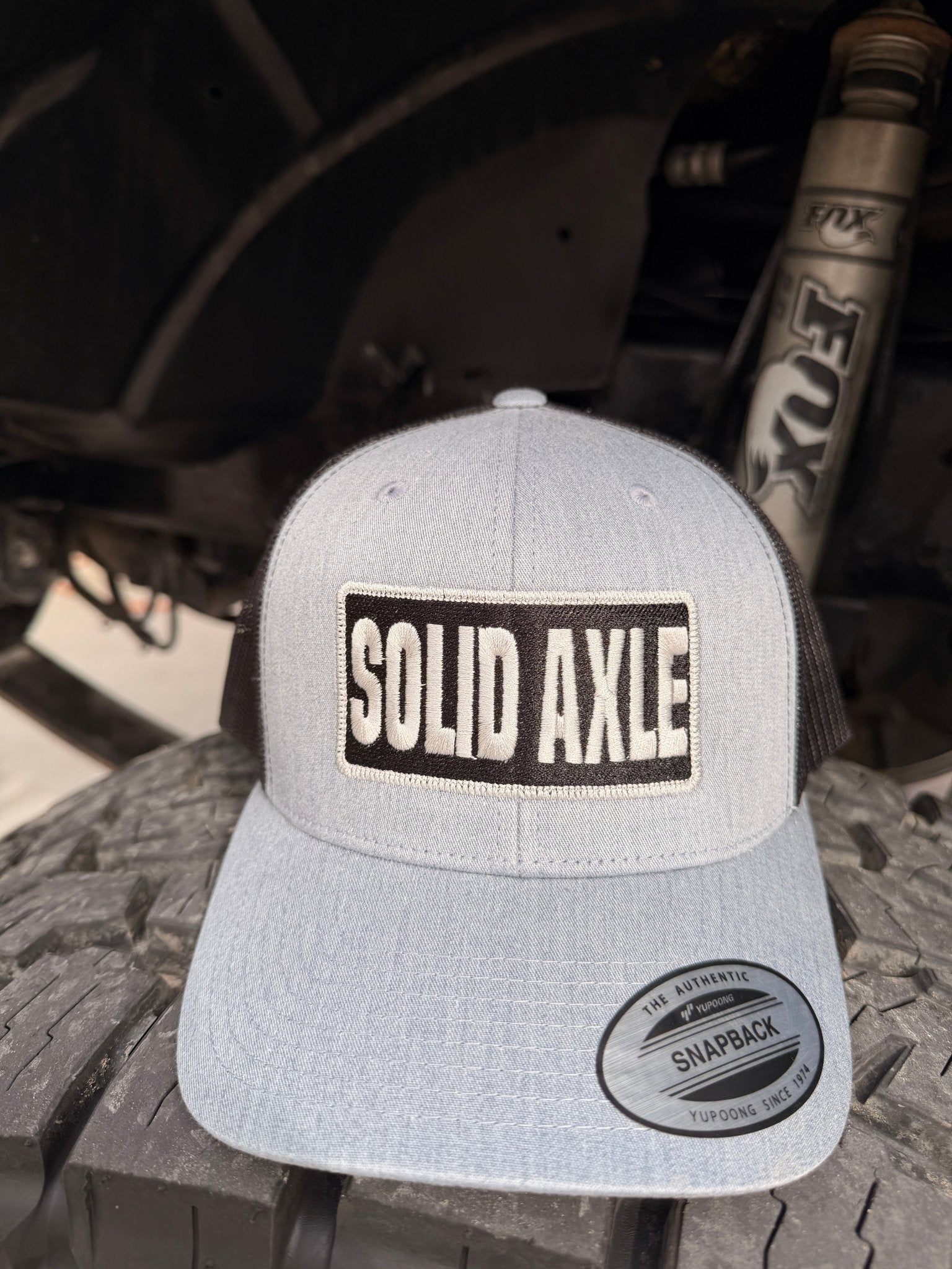 Yupoong Solid Axle Snapback Trucker Hat | Battle Born Clothing - Shop Battle Born Clothing