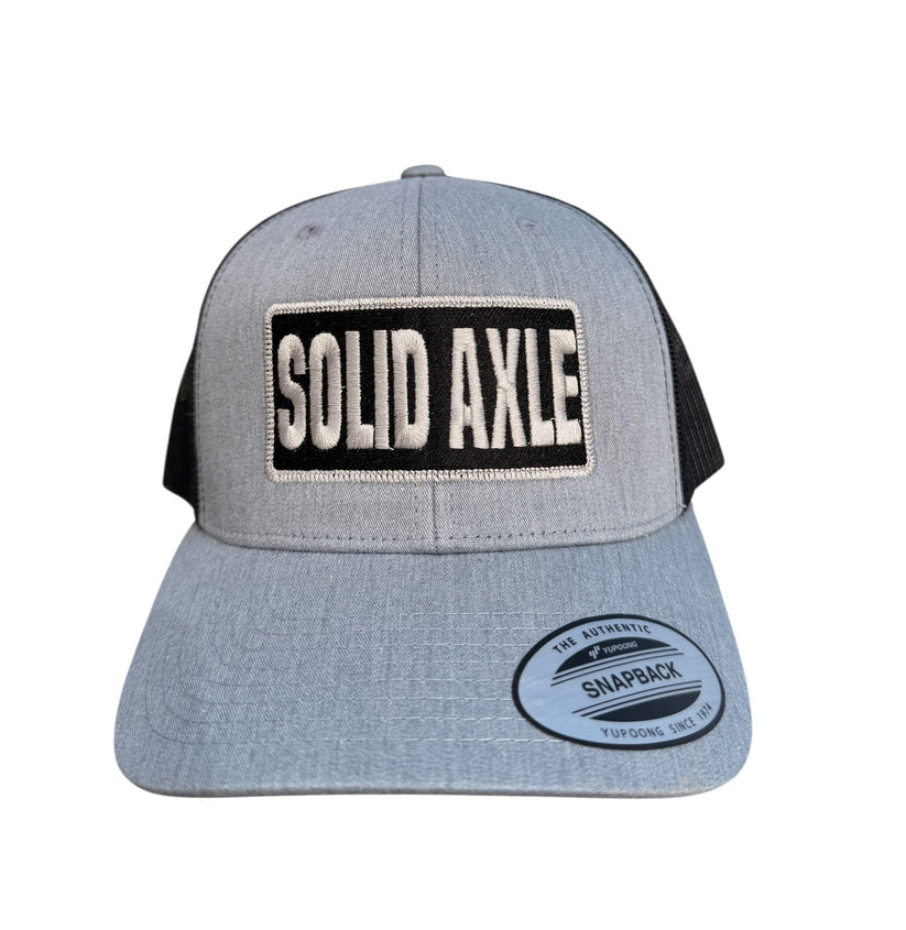 Battle Born Clothing embroidered Yupoong snapback trucker hat with SOLID AXLE logo - perfect registration on structured front